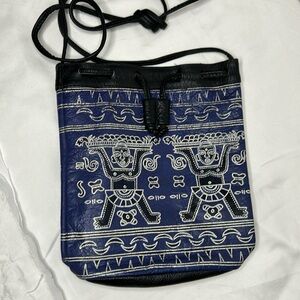 BARGANZA blue, black, and white Indian design print genuine leather bucket bag.